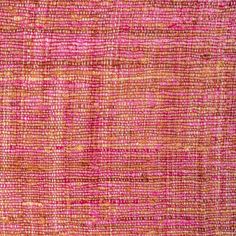 an orange and pink rug with some lines on it