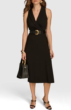 This sophisticated midi is designed in a sleeveless silhouette with a shawl collar and a defining embossed belt. 37 1/2" length Shawl collar Sleeveless Removable belt Unlined 63% polyester, 32% rayon, 5% spandex Dry clean Imported Elegant Black Belted Dress For Work, Elegant Black Belted Dress For Office, Chic Sleeveless Semi-formal Dress, Sleeveless Sleek Midi Dress For Work, Classic Belted Midi Dress For Evening, Sleek Sleeveless Midi Dress For Work, Chic Semi-formal Sleeveless Dress, Elegant Belted Midi Dress For Date Night, Elegant Black Belted Midi Dress