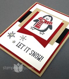 a card with a penguin on it and the words let it snow written in black ink