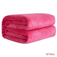 two pink towels stacked on top of each other