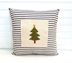 a pillow with a christmas tree on it