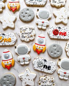 some cookies are decorated to look like astronauts