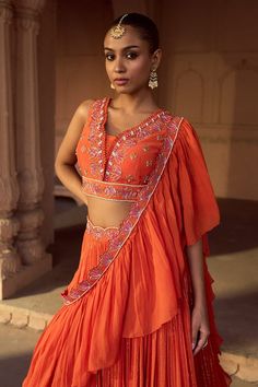 Orange gathered attached cancan lehenga with an embroidered belt. Paired with an orange padded blouse with gold embroidery and loop detailing on the neckline and a frill dupatta with gold scalloped border. - Aza Fashions Gathered Lehenga, Frill Dupatta, Cancan Lehenga, Lehenga Pattern, Padded Blouse, Scalloped Border, Embroidered Belt, Gold Embroidery, Embroidered Silk