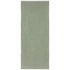 a green towel on a white background