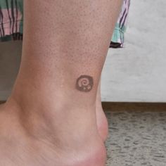 a person with a small tattoo on their foot