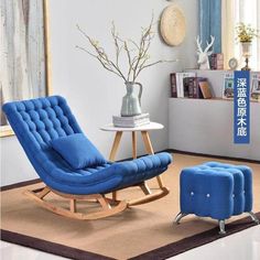 a blue rocking chair and ottoman in a living room