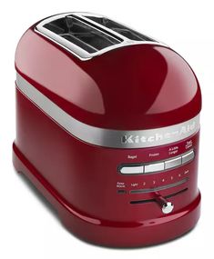 a red toaster sitting on top of a white table