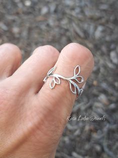 Sterling Silver vine ring, leaves - womens, leaf ring, autumn jewelry, 925 silver jewelry, gifts for mom *IF YOUR SIZE ISNT SHOWING, MESSAGE ME. I might be sold out and will be able to replenish shortly* Top of ring height: 19mm Band width: 9.2mm Metal: 925 sterling silver Plating: rhodium plated Finish: high polish This is a High Polished solid sterling silver ring with Rhodium plating to prevent tarnishing. Nothing but the best from my custom jewelry store. --------------------------- Please follow care instructions. Any rings with stones, regardless where you purchase, must be removed when washing hands or using hair gels or hair creams, and even chemicals and cleaners. To clean jewelry, you can use a toothbrush and some hand soap for simple easy cleaning. This is costume jewelry, not r Elegant Silver Leaf Shaped Ring, Elegant Silver Leaf-shaped Ring, Leaf-shaped Sterling Silver Jewelry For Anniversary, Minimalist Sterling Silver Leaf Jewelry, Silver Leaf-shaped Adjustable Jewelry, Minimalist Leaf-shaped Sterling Silver Jewelry, Dainty Sterling Silver Leaf Jewelry, Adjustable Silver Leaf Jewelry, Leaf-shaped Jewelry For Gift