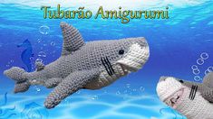 two crocheted stuffed sharks swimming in the ocean with caption that reads, tumbao angigarumi