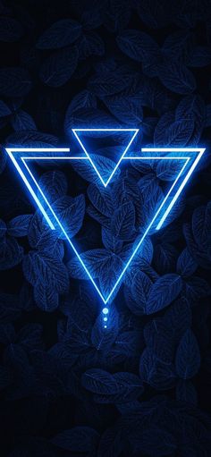 a blue neon triangle with leaves surrounding it