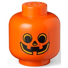 an orange lego brick with a jack - o'- lantern face on the front