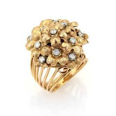 This is a magnificent vintage diamond cluster ring, it is crafted from solid 18k yellow gold with a cluster of textured finish spring flowers, each with a round cut diamond set in the center. The wide open multi-wire fancy design shank and shoulders tapers off to a smaller width band. Material: 18k yellow gold Measurements: 20mm across x 20mm wide x 14mm high Diamond: 0.30 total carat weight Color: H Clarity: SI Ring Size: 4 Weight: 10.6 grams Fancy Design, Gold Cocktail Ring, Gold Cocktail, Gold Band Ring, Ring Pictures, White Gold Band, Diamond Cluster Ring, Diamond Set, Diamond Cluster