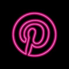 a pink neon sign on a black background with the letter p in it's center