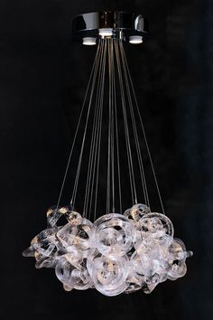 a chandelier with many clear glass balls hanging from it's center point