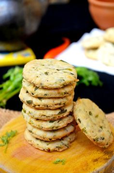 a stack of cookies sitting on top of a wooden cutting board