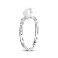 This pretty bypass ring showcases a pair of lustrous round freshwater cultured pearls meeting at the center. Shimmering round white lab-created sapphires twinkle as they line the sterling silver setting for a delightful finishing touch. Pearl Rings With Brilliant Cut, White Gold Pearl Ring For Anniversary, Silver Akoya Pearl Ring For Anniversary, Brilliant Cut Pearl Ring, White Gold Pearl Jewelry With Round Cut, White Pearl Jewelry With Round Cut, Pearl Jewelry With Brilliant Round Cut, White Round Diamond Ring Birthstone, White Round Diamond Birthstone Ring