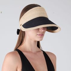 Natural vented hemp visor with black vented hemp bill and black grosgrain bow. From the Eugenia Kim Core Collection. 2.75"x 4.50" SKU: 21280-180CS Adjustable Black Visor For Outdoor, Black Adjustable Visor With Curved Brim, Adjustable Black Visor With Curved Brim, Adjustable Black Straw Hat For Outdoor, Black Straw Hat For Spring Outdoor, Black Curved Brim Visor For Outdoor, Black Brimmed Hat With Bow, Black Hat With Bow And Curved Brim, Black Straw Hat With Uv Protection And Curved Brim