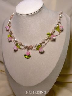 🌸 Embrace the enchanting beauty of nature with our whimsical fleur necklace. Crafted with pink opals and romantic flower charms, this necklace exudes feminine charm and elegance.  ⭐️Crystal Properties ⭐️ This necklace includes pink opal, which is closely associated with the heart chakra, emotional healing, gentleness, compassion, and tranquility.  💧❌ ~For optimal care, I recommend you to remove the necklace before showering, sleeping, or engaging in strenuous activities~ --------------- ⚒️MATERIAL  -Pink opal, faux pearls, glass, acrylic  -Rose gold plated /stainless steel hardware and chains  - Gold plated /stainless steel extender chain  🌎SHIPPING - This item will be shipped within 2~5 days (USA)  - All items come in an individual gift box  📲CONTACT - Follow "nabirising" on Instagram Fairy Wedding Necklace, Pink Butterfly Necklace, Pink Flower Charm Necklace With Flower Pendant, Handmade Charming Pink Jewelry, Charming Handmade Pink Jewelry, Pink Flower Necklace With Clavicle Chain, Pink Flower Clavicle Chain Necklace, Delicate Pink Pendant Flower Necklace, Cute Pink Flower Pendant Jewelry