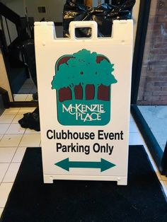 a white sign that says clubhouse event parking only on it and an arrow pointing to the right