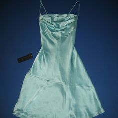 Gorgeous Mint Green Mulberry Silk Slip Dress By Bebe. Brand New With Tags. Size 4. Mini. Fully Lined. Adjustable Spaghetti Straps That Cross In The Back. Draped Front. I Am Happy To Answer Any Questions. Mint Dress Aesthetic, Aqua Blue Hoco Dress, Shimmery Dress Long, Mint Green Hoco Dress, Light Green Short Dress, Silvermist Costume, Mint Blue Dress, Cheap Hoco Dresses, Homecoming Inspo