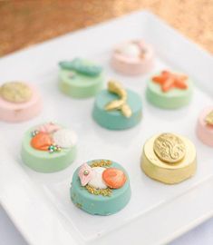 a white plate topped with lots of different types of cakes