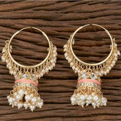 Peach Jhumka with pearl. Handcrafted pair of earrings. Gives a traditional look. Can be worn for engagement and wedding parties. Indulge in it or gift it and watch the compliments flow! It is advisable to store jewelry in a zip lock pouch (air tight pouch), keep away from water perfume and other chemicals and clean it with soft cloth. Festival Chandbali Hoop Earrings With Pearl Drop, Bollywood Style Pearl Drop Hoop Earrings For Festive Occasions, Festive Temple Jewelry Pearl Earrings With Latkans, Traditional Pearl Drop Hoop Earrings For Celebrations, Festive Pearl Drop Hoop Earrings For Festivals, Festive Pearl Drop Hoop Earrings, Bollywood Festive Hoop Earrings With Meenakari, Festive Bollywood Hoop Earrings With Meenakari, Diwali Temple Jewelry Pearl Earrings With Latkans