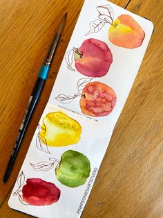 the watercolors are being used to create this fruit painting on paper with colored pencils