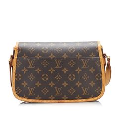 This Louis Vuitton Sologne was made from brown monogram canvas. The Bag features trim and an adjustable flat shoulder strap with vachetta leather shoulder pad, gold detailing, a flap with a buckle closure, exterior pockets on the front and, and an interior compartment. The Bag is best across the body. Central African, Nicolas Ghesquiere, Monogram Canvas, Shoulder Pads, Louis Vuitton Monogram, Balenciaga, Fendi, Shoulder Strap, Dior