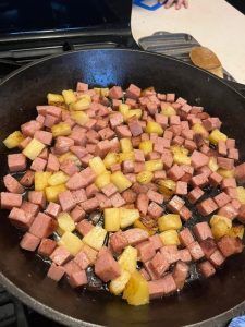 a pan filled with food sitting on top of a stove