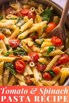 a pan filled with pasta, tomatoes and spinach