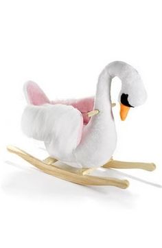 a white swan on a wooden rocking toy with pink linings and feet, sitting in front of a white background