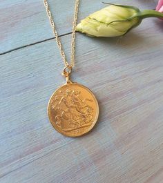 This coin pendant necklace was 100% handmade. The pendant is made of a Moroccan gold coin to which I designed with a vintage inspired fashion. The necklace is 14k gold filled chain with a 14k gold plated coin pendant. It is also available in sterling silver. Dimensions: The 14k gold necklace is available in multiple lengths. The antique coin pendent's diameter is 2.1 cm (0.8 inches) This Gold coin necklace is delicate unique and beautiful for daily wear. To see other necklaces I make: https://ww Vintage Yellow Gold Tarnish Resistant Medallion Necklace, Vintage Yellow Gold Tarnish-resistant Medallion Necklace, Vintage Gold Medallion Necklace Tarnish Resistant, Vintage Coin-shaped Tarnish Resistant Jewelry, Vintage Tarnish-resistant Coin-shaped Jewelry, Vintage Tarnish-resistant Coin Jewelry, Classic Gold Coin Necklace With Round Pendant, Classic Yellow Gold Charm Necklace With Coin Pendant, Vintage Yellow Gold Coin Necklace, Tarnish Resistant