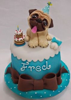 a birthday cake with a pug sitting on top