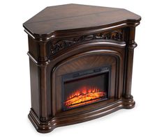 a wooden fireplace with an electric fire in it