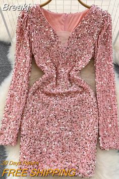 a pink dress with sequins on it and the words free shipping written below