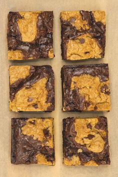 four squares of brownie with chocolate chips on top and one square cut in half