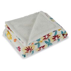 three towels stacked on top of each other in different colors and patterns, with one folded up