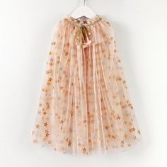 PRICES MAY VARY. ✨Princess Costume Cape for Girls: Sparkly and dreamy, this costume cape is as though the touch of a fairy godmother has made it. This girl's princess cape is sure to add glamour to any outfit for play, a birthday outfit or holiday dress. ✨Magic in the Details: Little girls princess cape comprises a layered apricot color tulle fabric that feature silver stars all over that shimmer in the light and will never shed. Cape has glimmering irisdescent sequined trims attached along the Kawaii Costumes Halloween, Princess Party Outfit, Princess Cloak, Diy Princess Costume, Princess Cape, Cloak Dress, Dress Up Clothes, Apricot Clothing, Tulle Cape