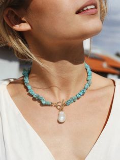 1.STYLE:  Turquoise necklace is the kind of statement piece that mentally transports you to a state of vacation, even when you're just headed for a local outing with friends. While the big pearl of baroque shape in the middle echoes the casual vibe. The combination of natural stones along with the elegant pearl made up of our debuted summer necklace. 2.DESIGN:  Summer camp style jewelry has been trending, the statement necklace elevates the trend with two kinds of stones playfully mixed and matched. With fine luster and contrasting textures, the baroque pearl of 15*25mm adds a touch of elegance and delicacy to the boho jewelry. And the turquoise nuggets of irregular shape give the toggle necklace the more fun of the wild. 3.OCCASIONS:  A colorful beaded necklace appears a timeless choice t Bohemian Turquoise Necklace For Vacation, Turquoise Beaded Jewelry For Vacation, Turquoise Bohemian Necklace For Vacation, Elegant Turquoise Necklace For Beach, Green Turquoise Necklace For Beach, Big Beads Jewelry, Accesories 2024, Summer Camp Style, Statement Turquoise Necklace