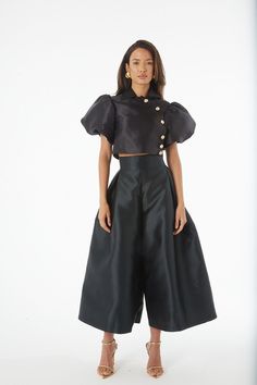 An artful mix between Culottes and a skirt, these Culottes are a dramatic statement piece, mixing a sharp, high waist and wide leg, with an elegant and unusual pleated detail at the front - the look of a skirt in a trouser. Fit - Fits true to size. Take your normal size. Silk High-waisted Pants For Party, Chic Skirt For Spring Costume Party, Silk Party Trousers, Spring Satin Party Bottoms, Spring Party Satin Bottoms, Spring Satin Full Skirt Bottoms, Summer Party Satin Bottoms, Satin Trousers For Party, Satin Party Trousers