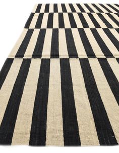 a black and white striped rug is shown