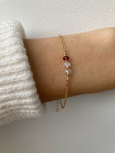 This dainty bracelet features the gentle essence of moonstone, tourmaline and aquamarine  that are associated with fertility and a healthy pregnancy. D E T A I L S *Made with a trio of AAA quality gemstones that measure between 3.5 and 4.5mm. *Choose between a stainless steel chain available in gold, silver, rose gold or a 14k gold filled chain, rose gold filled or sterling silver chain. *The gemstones included are moonstone, aquamarine and pink tourmaline. *Bracelet comes with care instructions an explanatory crystal information card and as with all our products is gift ready. S I Z I N G * H E L P Choose the length you prefer from the drop down menu. Use the length guide as a reference. This bracelet is adjustable as a snug fit will work best for this bracelet to stop it rolling. This me Dainty Moonstone Bracelets For Everyday, Dainty Moonstone Bracelets With Natural Stones, Dainty Moonstone Bracelet With Natural Stones, Dainty Everyday Crystal Birthstone Bracelet, Everyday Dainty Birthstone Crystal Bracelet, Everyday White Birthstone Bracelets, Everyday White Birthstone Bracelet, Dainty Birthstone Bracelets For Healing, Dainty Hypoallergenic Healing Bracelet