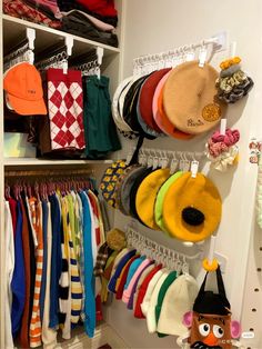 a closet filled with lots of hats and scarves