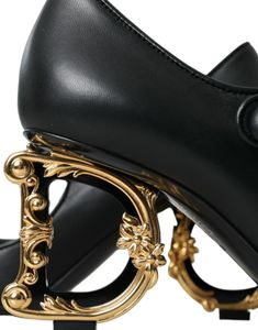 Luxurious Dolce & Gabbana Black Leather Logo Mary Jane Pumps. Crafted from 100% Lamb Leather, these pumps feature a leather bottom sole and iconic logo details. Made in Italy, these pumps will elevate any outfit. Nappa leather Solid color, Leather backing, Elasticized gores, Narrow toe-line, Sculpted heel, Leather sole, Product code: 17384602UL Messenger Bag Backpack, Mary Jane Pumps, Mary Jane Heels, Pumps Shoes, Dolce E Gabbana, Boot Pumps, Leather Logo, Heels Shoes, Seychelles