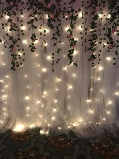 the curtain is covered with lights and vines