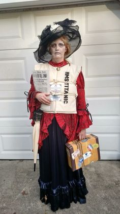 a woman dressed in costume holding a suitcase