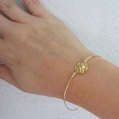 Rose Bracelet - Rose Jewelry - A gold tone pure brass rose flower charm has been transformed into a dainty & delicate rose flower bangle bracelet with a gold tone brass band. Perfect for those who like Victorian jewelry themes! I can also make this rose bangle bracelet with a 14k gold filled band for an additional $10. If you would like this option for your rose jewelry, select from options when ordering. This gold rose bracelet stacks great with other bangles from my collection as you can s Delicate Adjustable Rose Jewelry, Delicate Adjustable Rose-colored Jewelry, Gold Flower Bracelets With Rose Design, Gold Floral Bracelets With Rose Design, Gold Flower Bracelet With Rose Design, Adjustable Gold Bracelet With Rose Design, Gold Bracelets With Flower Charm For Wedding, Delicate Gold Bracelets With Flower Charm, Delicate Gold Bracelet With Flower Charm