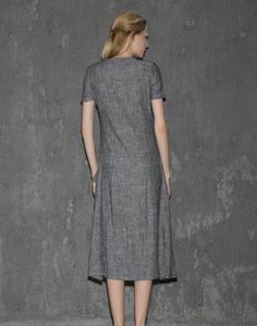 A cool linen dress is an absolute must-have in any woman's wardrobe. The loose-fitting style of this gray dress will give you not only comfort but also a fabulous silhouette no matter what size you are. Whether you decide to wear this dress for lounging around the house or at the office, you'll know that you'll be able to keep cool. Anyone who has experienced the coolness of wearing cool linen fabric would never want to not own linen clothing. This is especially true when it comes to women's dre Gray Shift Dresses For Summer, Casual Gray A-line Midi Dress, Gray Short Sleeve Midi Dress For Summer, Gray Knee-length Midi Dress For Summer, Gray Knee-length Summer Midi Dress, Gray Midi-length Summer Dresses, Spring Gray Shift Dress, Casual Long Dress For Workwear, Gray Shift Dresses