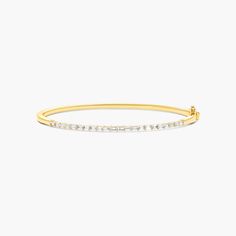 14K Yellow Gold Baguette Lane Lab-Created Diamond Bangle Bracelet. You'll love the anytime appeal of this classic bangle bracelet. Fashioned in 14K yellow gold, this piece showcases a row of horizontally set lab-created baguette diamonds that create a gleaming beam of light. This bangle secures with a single snap clasp. Classic Gold Bangle With Baguette Diamonds, Elegant Baguette Cut Bangle, Classic Bangle With Baguette Diamonds Cut, Classic Yellow Gold Bracelet With Baguette Diamonds, Classic Gold Diamond Bracelet With Baguette Diamonds, Gold Baguette Diamond Bracelet In Classic Style, Modern Yellow Gold Bracelet With Baguette Cut, Formal Yellow Gold Bangle With Baguette Diamonds, Classic Gold Baguette Diamond Bracelet