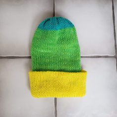 This super soft and plush hat is made from acrylic gauge 4 worsted yarn. The material is 100% acrylic and feels very soft. This hat will fit a medium to large adult, pending your head size. Unstretched it is 13 inches tall with the brim down and 7.5 inches wide. It is very stretchy so it can stretch to be about 12 inches wide so it will fit a variety of heads.  It is a regular knitted pattern, double walled for an extra layer of warmth. It can be worn as a more slouchy beanie style or pulled dow One Size Fits Most Acrylic Cap, One Size Acrylic Cap, Green One Size Beanie, Knitted Acrylic Beanie Cap, Acrylic Knitted Beanie Cap, Green Slouchy Yarn Hat, Green Soft Knit Hat For Cold Weather, Green Warm Beanie One Size, Green Yarn Beanie One Size Fits Most